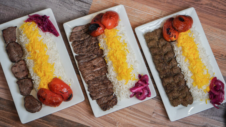 Beef kabob, tenderloin kabob, ground beef kabob skewers over abed of saffron rice at Linworth Grill in Columbus Ohio”